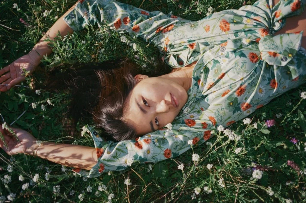 Zen lying in a flower meadow